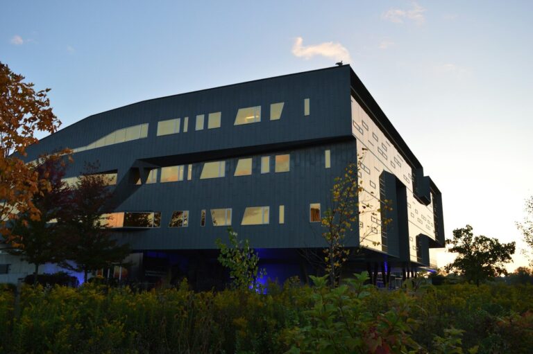 Modern building with unique architecture at dusk